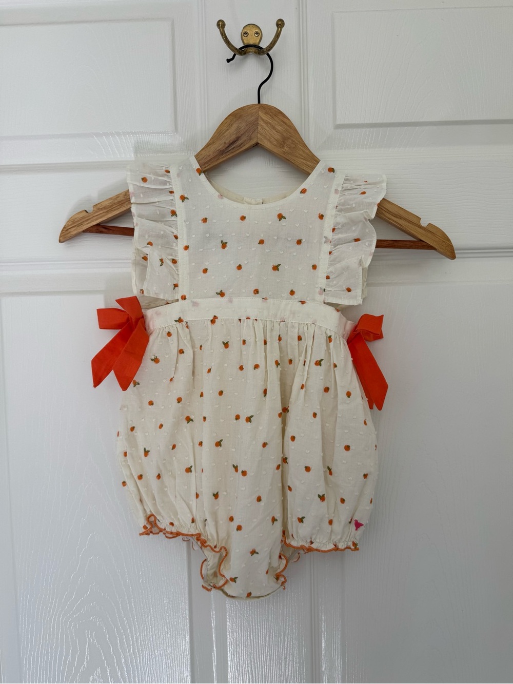 Pink Chicken Cream Bubble Romper with Orange Bow Accents